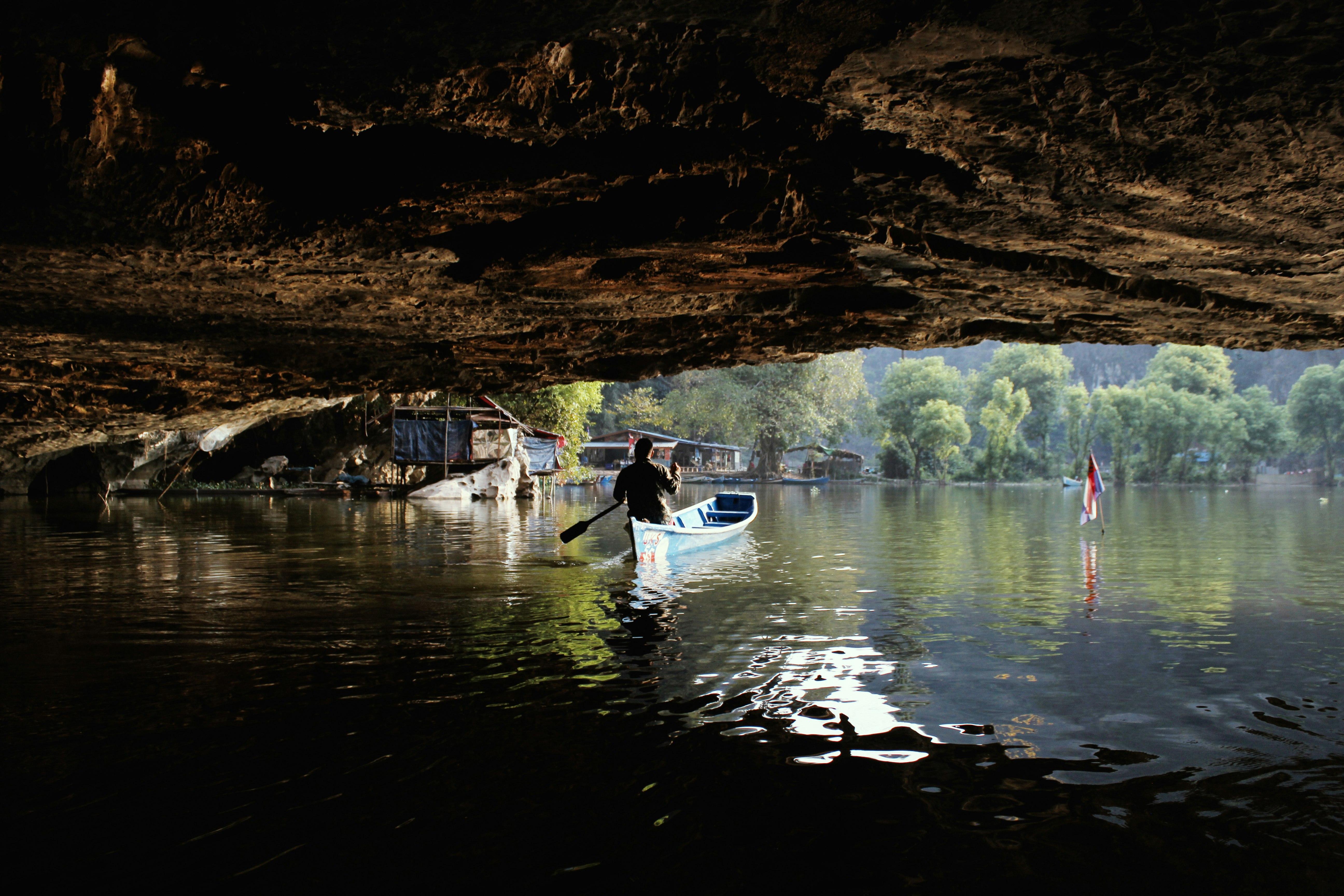 A person kayaking in Saddan Cave, Hpa-An, Myanmar