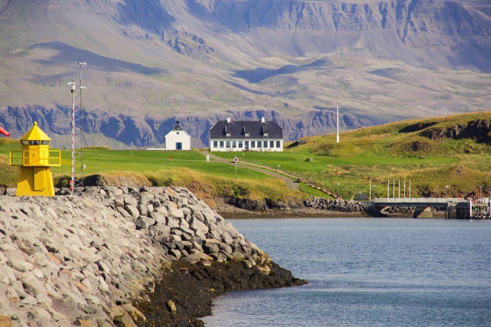 A picturesque Norwegian fjord surrounded by lush green hills