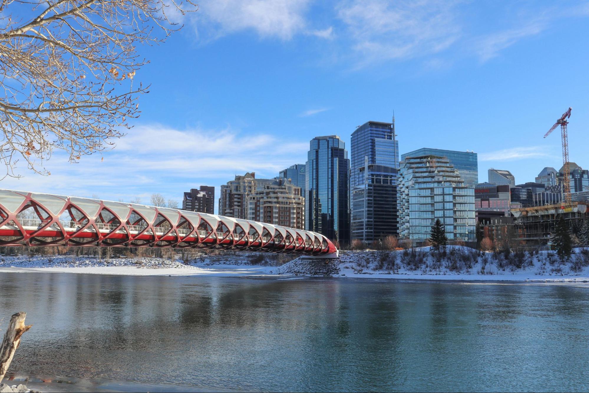 Calgary skyline with Bow River and Rocky Mountains backdrop