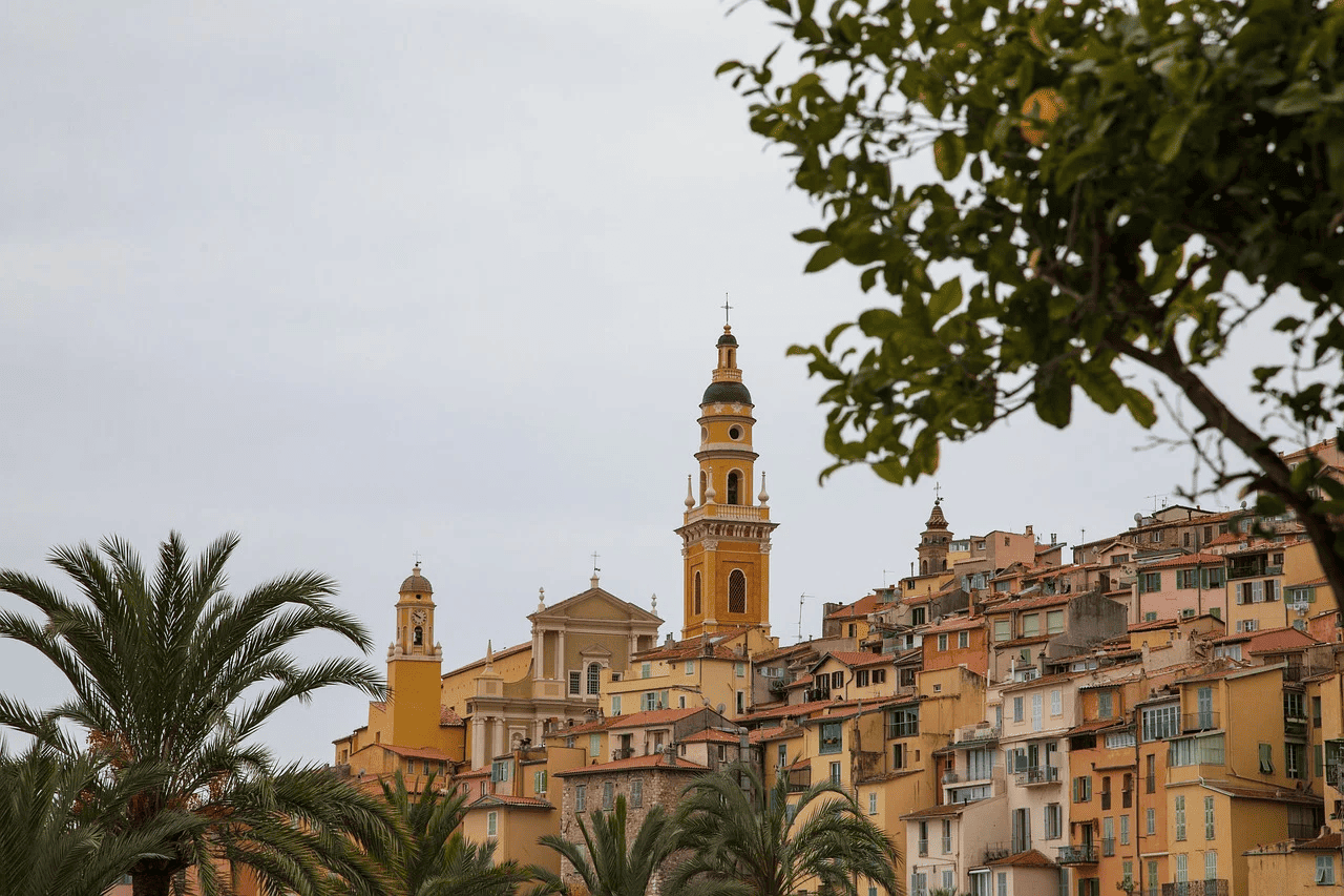 Colorful cityscape of Menton France with lemons and church