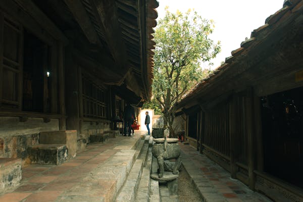Narrow stone pathway between two temples