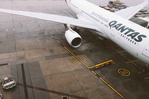 Qantas aircraft wing and engine on tarmac