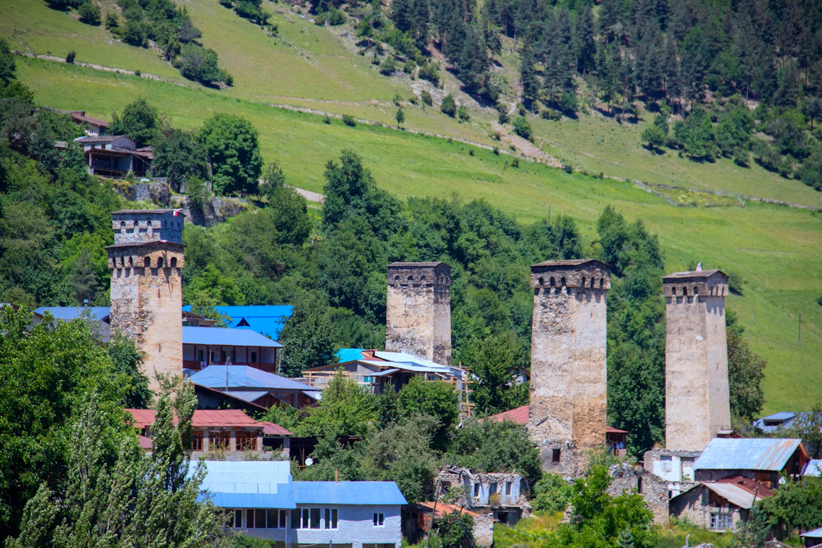 Svan towers in Mestia against early fall mountains 