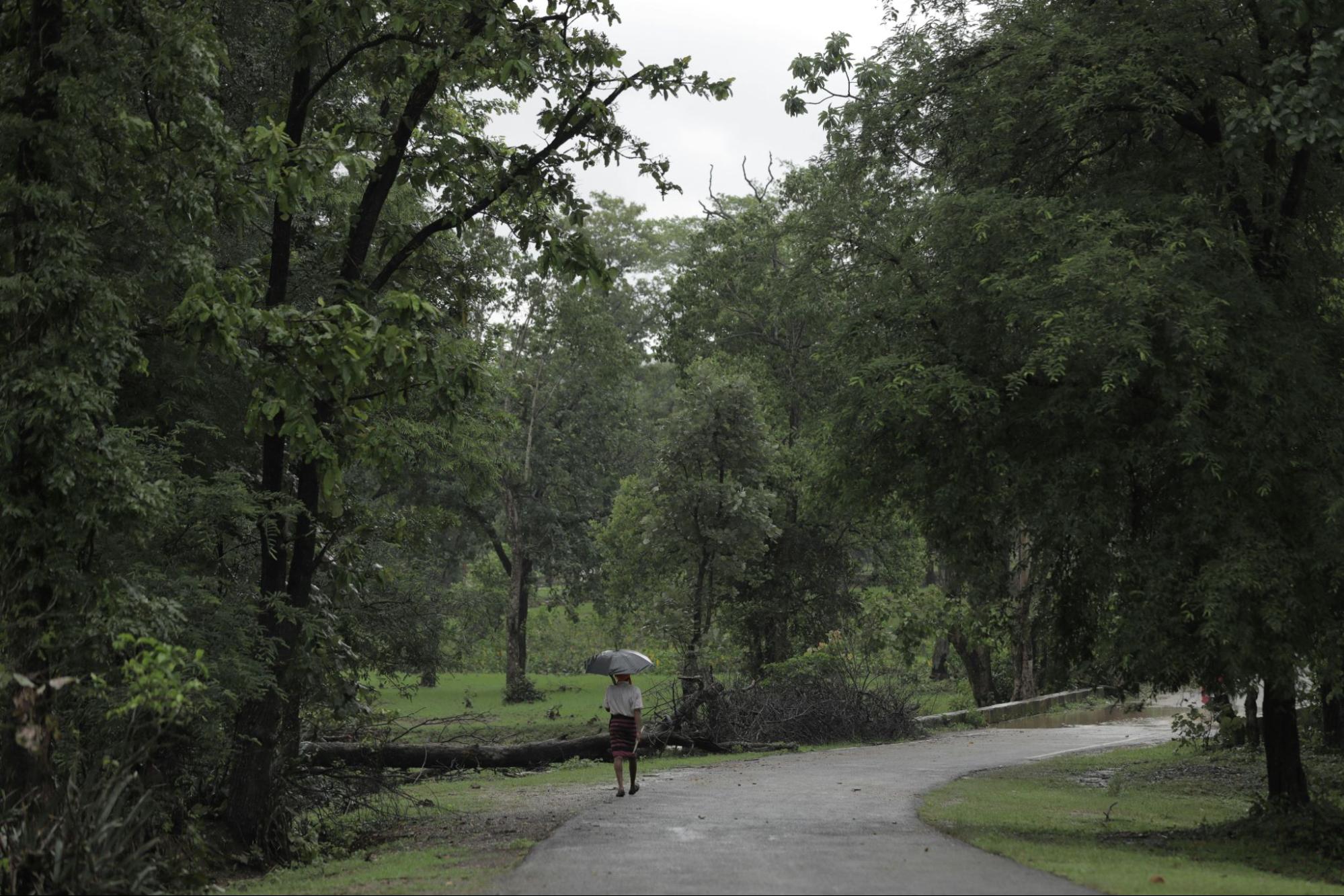Tourist doing a monsoon walk in Cambodia