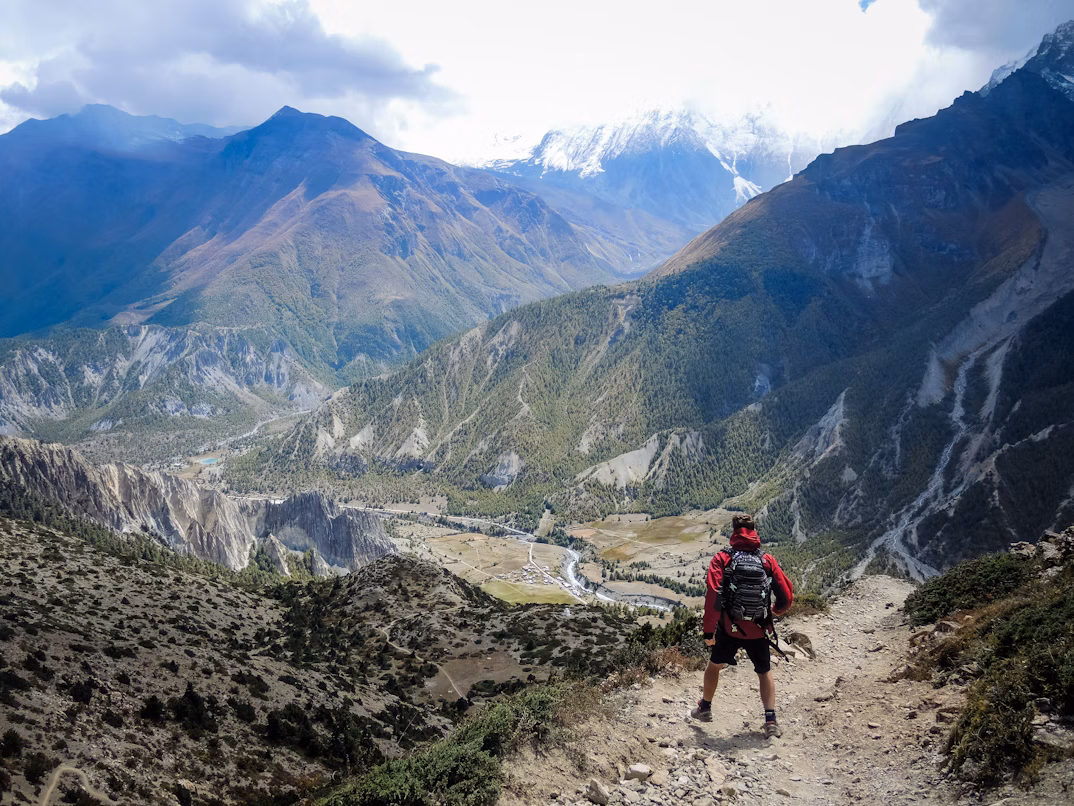 Traveler in light jacket and hiking shoes hiking Annapurna
